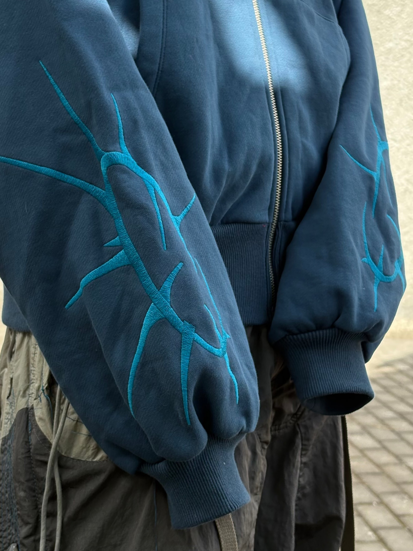blue spikey-zip